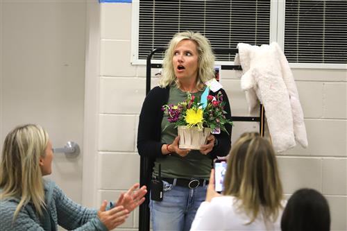 Mrs. Schultz is surprised by her award.